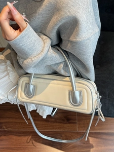 Minimalist beige and silver leather boston bag with stylish crossbody strap for women