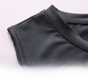 Detailed macro shot of reinforced neckline stitching on men's quick-dry gym vest