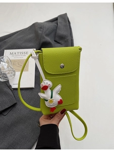 Crossbody phone bag in vibrant green pebble leather with a cute cartoon duck charm
