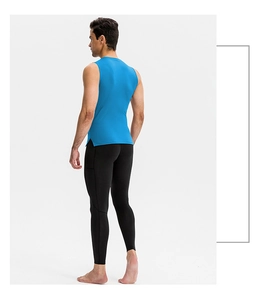 Detail view of high-elasticity bright blue gym vest with side slits and black compression leggings
