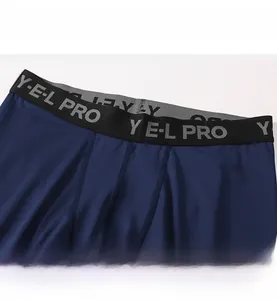 Close-up of wide elastic waistband with pro lettering on men's compression pants