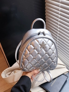 Mini silver metallic quilted backpack with star detail and star-shaped stud embellishment