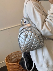 Silver metallic quilted mini backpack for women featuring a star stud detail
