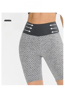Detail of high waist tummy control waistband on honeycomb textured fitness shorts