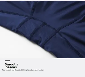 Detail of four-needle six-thread stitching on navy compression pants with breathable mesh