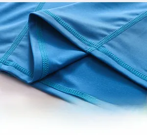 Close-up of sky blue sports vest hem featuring durable flatlock stitching and elastic fabric