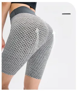 Detail of high waisted yoga shorts with 3D honeycomb texture and butt lifting effect