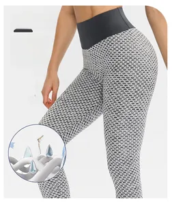 Close-up of light grey honeycomb textured fabric on high waist scrunch butt leggings