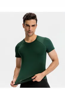 Men's dark green compression shirt with raglan sleeves for athletic gym training