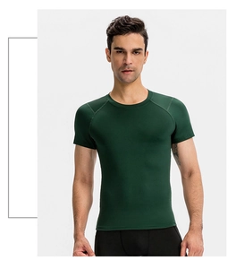 Detail of professional dark green compression gym t-shirt with raglan sleeves for men