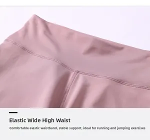 Close-up of high-waist yoga shorts showing durable double-stitching and pink performance fabric