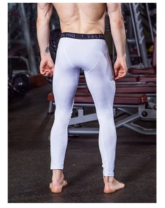 Macro shot of white compression pants with wide black elastic waistband for men