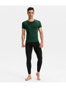 Front view of men's dark green compression t-shirt and black leggings fitness set