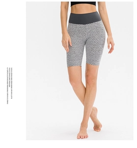 Close-up of high-waist honeycomb texture yoga shorts with grey tummy control band