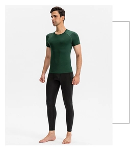 Detailed side view of dark green men's compression fitness top with elastic fabric