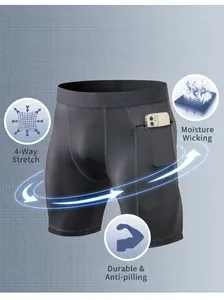 Detalle de pantalones cortos de compresión gris oscuro con bolsillo lateral y tela elástica