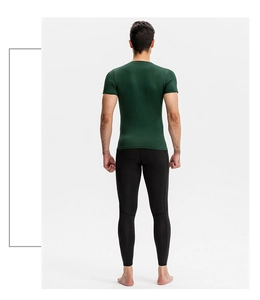 Rear view of men's compression fitness set with green short sleeve and black tight pants