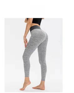 Detail showing high waisted leggings with honeycomb texture and butt lifting scrunch design