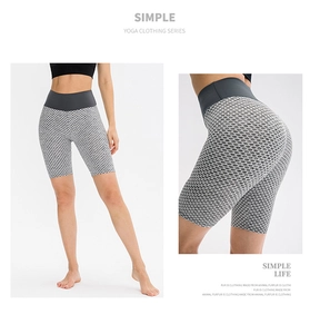 Close-up of high-waisted honeycomb texture yoga shorts featuring quick-dry fabric and peach lift