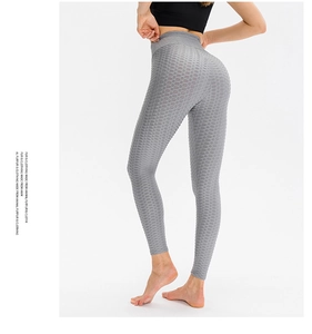 Detail of grey honeycomb texture on high-waisted yoga pants with butt-lifting effect