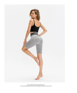Detail of high waist grey honeycomb textured yoga shorts with booty lifting effect