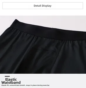 Detail view of elastic waistband on men's compression pants for secure fitness training