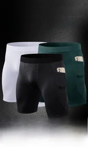 Detail of men's athletic shorts showing side phone pockets and breathable fabric textures