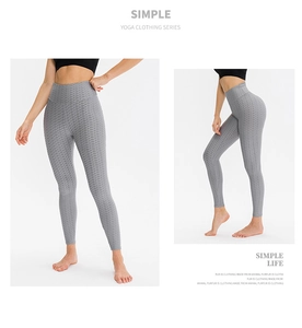 Close-up of high waist yoga leggings featuring grey honeycomb texture and seamless fabric