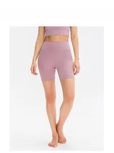 Lilac high waist yoga shorts and sports bra set on model in clean studio view