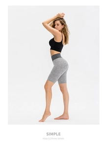Close-up of high-waisted yoga shorts featuring honeycomb texture and scrunch butt lifting detail