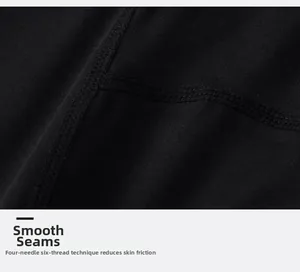 Close-up of four-needle six-thread flat seam stitching on black compression gym pants