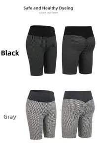 Detail of high waisted yoga shorts featuring bubble texture in black and grey colors