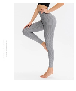 Detail showing high waist honeycomb texture on grey yoga leggings for butt lifting