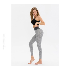 Detail showing high waist honeycomb texture and ruched seam on grey yoga leggings