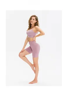 Close-up of side view of high-waist fitness shorts and bra in mauve pink fabric