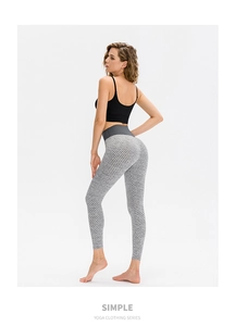 Close-up of honeycomb textured high waist yoga leggings with butt lifting design