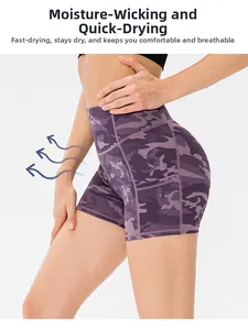 Detail of high waisted purple camo sports shorts with side pockets and peach lift seam