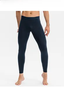 Men's compression fitness pants in deep blue featuring flexible flat-lock seam construction