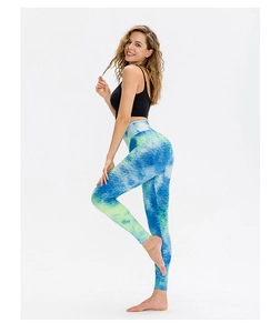 Detailed macro shot of honeycomb texture on blue-green gradient high waist yoga leggings