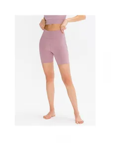 Detailed texture of seamless high-waisted yoga shorts in dusty rose for fitness