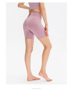 Close-up of high-waist yoga shorts in light purple with seamless peach butt design