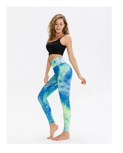 Close-up of high-waisted tie-dye yoga leggings with honeycomb texture and scrunched detail