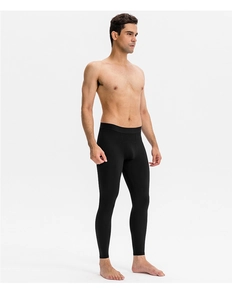 Side view of men's quick-dry compression pants showing elastic fabric and tight athletic fit