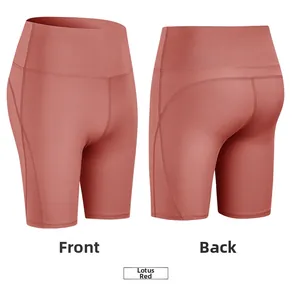 Front and back view of hibiscus red high waist yoga shorts with peach hip lifting seam