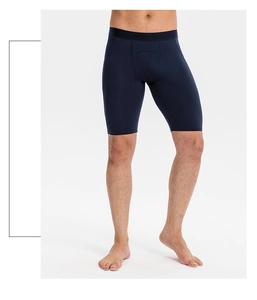 Detail view of men's navy blue compression shorts featuring elastic waistband and stretch fabric