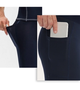 Detail of navy blue compression shorts featuring side phone pocket and flatlock stitching