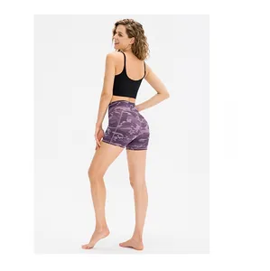 Detail view of high waisted purple camo fitness shorts with seamless elastic fabric