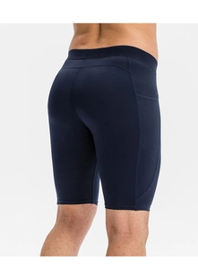 Detail of men's blue compression shorts showing side pocket and ergonomic back seams