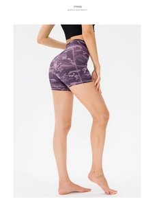 Detailed back view of purple camo high waisted yoga shorts with a peach butt lifting design