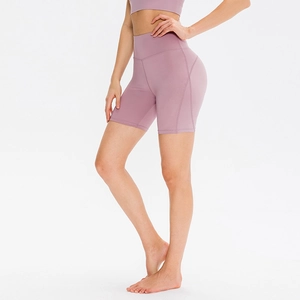 Women's high waist yoga shorts in dusty rose with ergonomic seams and stretch fit